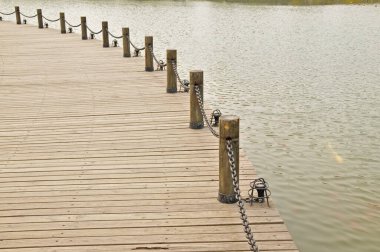 Wooden pier on the lake  clipart