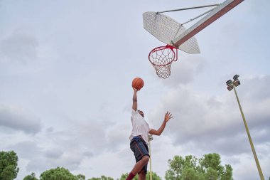 basketball player making slam dunk clipart