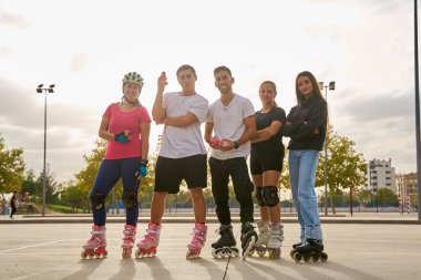 Group of rollerbladers posing confidently in an outdoor park clipart