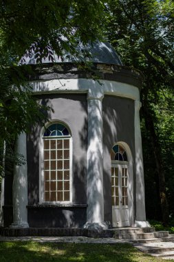 old outhouse in the park