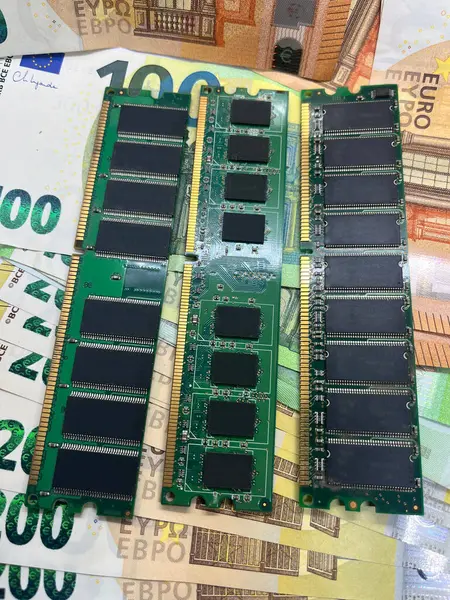 Close-up of computer RAM chips on Euro banknotes 100 Euro 200 Euro