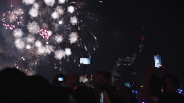 Silhouette Crowd People Hands Recording Beautiful Fireworks Using Mobile Phones — Stock Video
