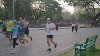 People Exercise Morning Running Jogging at Lumphini Lumpini Lumpinee Park Bangkok, Thailand - Healthy Lifestyle Slow Motion