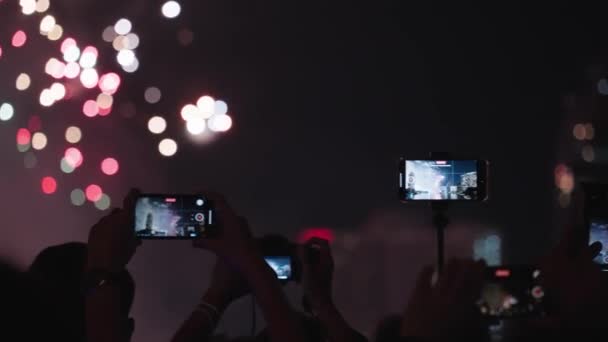 Silhouette Crowd People Hands Recording Beautiful Fireworks Using Mobile Phones — Stockvideo