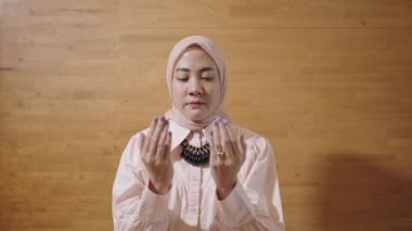Modern Muslim Woman on Hijab Southeast Asian - Praying to God Islam, Salah Salat, Kneeling