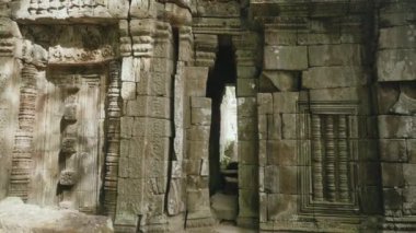 Ta Prohm Temple Bayon Style in Angkor Archeological Park - Tree Roots Over Stones, Probing Walls and Terraces Apart