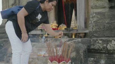 People Praying to God at Phnom Bakheng Angkor Temple Siem Reap, Cambodia