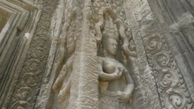 Ta Prohm Temple Bayon Style in Angkor Archeological Park - Close Up Detail Relief Wall and Scupture