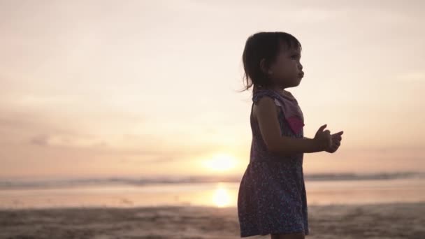 Happy Indonesian Toddler Walking Dancing Laughing Enjoying Sunset Beach — Stockvideo