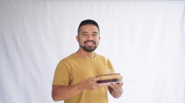 Male Model Blowing Candle Happy Birthday Cake White Background