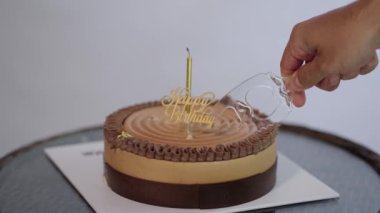 Cutting Happy Birthday Cake with Candle White Background