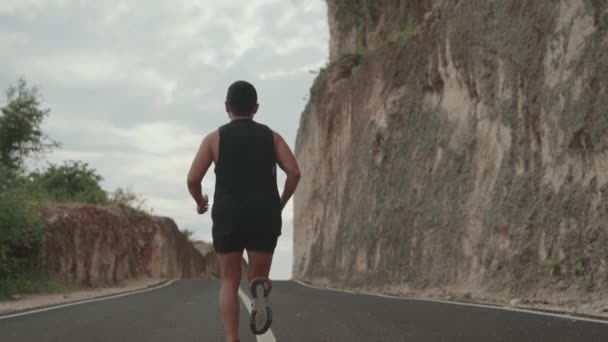 Sporty Active Man Running Road Wall Rocks Slow Motion — ストック動画