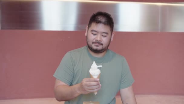Man Male Model Licking Vanilla Ice Cream Pink Background — Stock Video