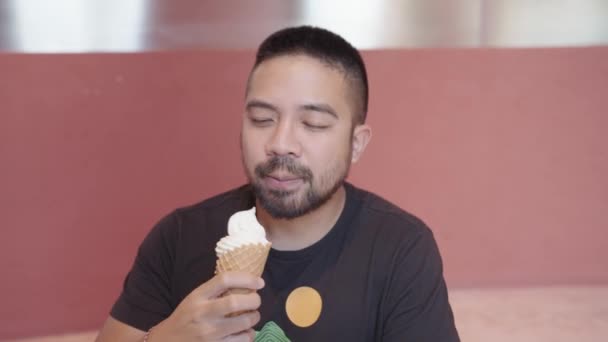 Man Male Model Licking Vanilla Ice Cream Pink Background — Stock Video