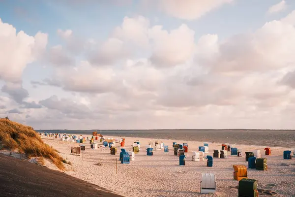 stock image sunset view of beach chairs and sand dunes of Heiligenhafen, Marina Resort, Baltic Sea, Ostholstein, Schleswig-Holstein, Germany 