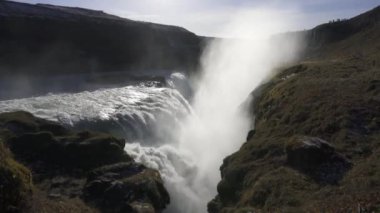 Gullfoss waterfall in Hvt river canyon in southwest Iceland. Popular falls on the Golden Circle tourism route. View from the top of second stage. 