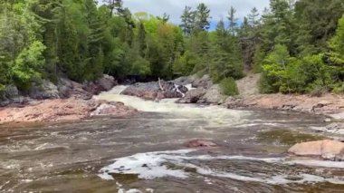 Chippewa Falls in Algoma, Ontario, Canada. Wide and cascading Chippewa Falls are located at halfway point of Trans-Canada Highway. Highway 17 at Chippewa River, Batchawana Bay.