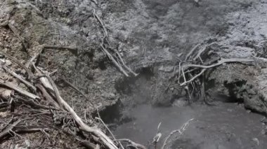 Bubbling mud pots in Qualibou, or Soufrire Volcanic Center, caldera on island of Saint Lucia. Sulfur Springs active geothermal area located in center of caldera. Caribbean's only drive-in volcano.