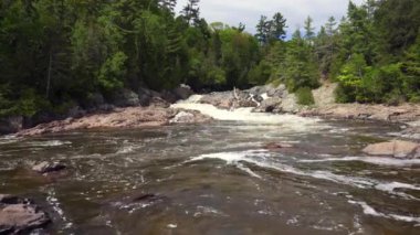 Chippewa Falls in Algoma, Ontario, Canada. Wide and cascading Chippewa Falls are located at halfway point of Trans-Canada Highway. Highway 17 at Chippewa River, Batchawana Bay.