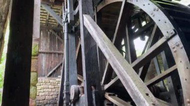 Hopewell Furnace National Historic Site in Pennsylvania. Hopewell's 22-foot diameter waterwheel catches a flow of water from French Creek to power the furnace's air blast machinery.