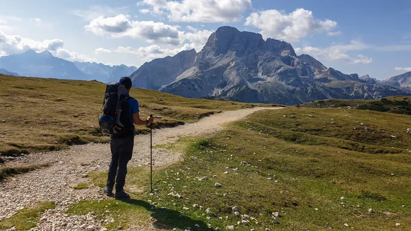Man Hiking Backpack Hiking Gravelled Road Italian Dolomites Massive Mountain — Stock fotografie