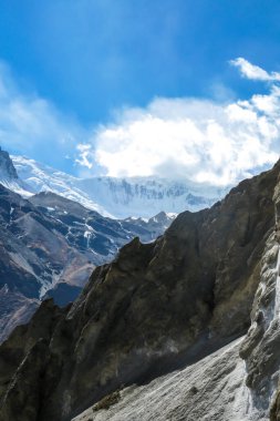 A dangerous passage along the landslide area on the way to Tilicho Base Camp, Annapurna Circus, Himalayas, Nepal. Dry and desolated landscape. Steep and sharp slopes. Extreme trekking