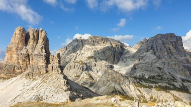 A panoramic view on Toblinger Knoten and surrounding mountains in Italian Dolomites. Difficult ad dangerous climbing route. Stony valley below. Few narrow pathways on the side. Freedom and serenity