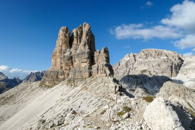 A panoramic view on Toblinger Knoten and surrounding mountains in Italian Dolomites. Difficult ad dangerous climbing route. Stony valley below. Few narrow pathways on the side. Freedom and serenity