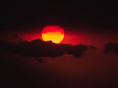 Intense sunset that is engaging with the meaning of life. The vibrant and warm colors create romantic emotions. Indonesia is a place where your soul finds peace and motivation for the future.