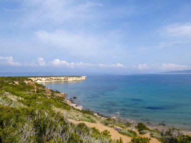 Panoramic view on Lara Beach, Cyprus from above. Hidden gem, not spoiled by tourists. Solitude, calm feelings, waves gently spreading on the beach. turquoise color of the water. Turtle hatching beach