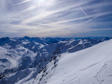 Beautiful and serene landscape of mountains covered with snow in Moelltaler Gletscher, Austria. Thick snow covers the slopes. Clear weather. Perfectly groomed slopes. Massive ski resort. Glacier skiing