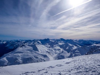 Beautiful and serene landscape of mountains covered with snow in Moelltaler Gletscher, Austria. Thick snow covers the slopes. Clear weather. Perfectly groomed slopes. Massive ski resort. Glacier skiing