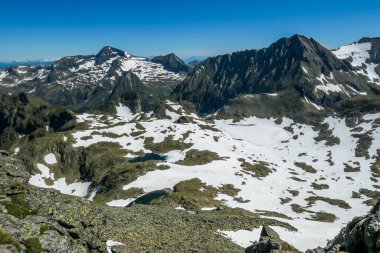 Massive mountain range of Schladming Alps, Austria. The slopes are steep, partially covered with snow. Nature waking up. Dangerous mountain climbing.Clear and beautiful day. Endless mountain ranges