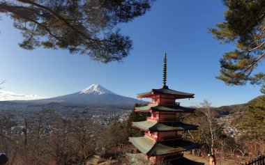 Panoramic shot of a soft reflection of an Alpine mountain in Wolayer Lake Austria. Completely still surface of the lake. Mountain is catching the first sunbeams. Peace of mind, calmness. High altitude