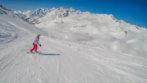 Snowboarder Girl Sitting Slope Admiring Tall Alps Front Her Slopes — Φωτογραφία Αρχείου