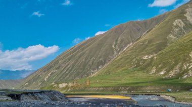 The Terek (Tergi) river flows down the Truso Valley near the Ketrisi Village Kazbegi District,Mtskheta in the Greater Caucasus Mountains,Georgia. Mineral springs, geyser, mineral lake clipart