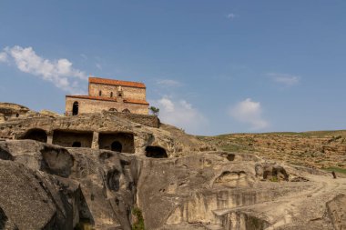 Ancient cave city of Uplistsikhe overlooking the Mtkvari river, in the Shida Kartli Region of Georgia, Caucasus, Eastern Europe. Church of the Prince at Uplistsikhe. Near Gori. Historical place clipart