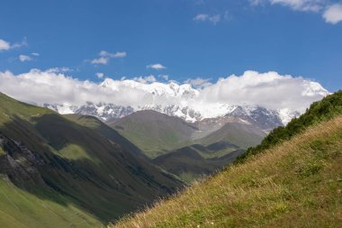 A hiking trail leading to Chubedishi viewpoint. There is an amazing view on the Shkhara Glacier,near the village Ushguli the Greater Caucasus Mountain Range in Georgia, Svaneti Region. Pasture, Meadow clipart