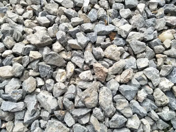 stock image small pebbles scattered in the yard which serves to hold back the flow of water so that flooding does not occur in the yard