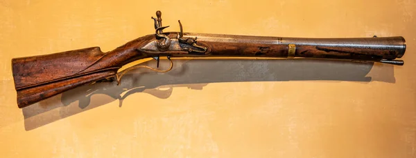 Background with with with ancient wooden gun