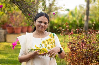 A Picture of middle aged malayali woman wearing a traditional kerala clothing clipart