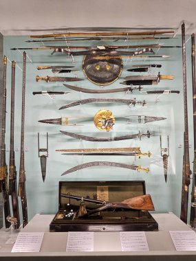 A picture of an Armor and  different weapon like spear,Indian Katar Dagger,Thalwar,knifes and rifles used in Mewar army in Rajasthan from 16th century to 20th century    clipart