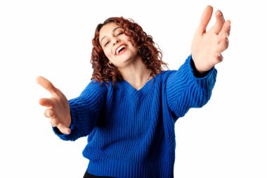 Young woman smiling confident standing isolated over white background looking at the camera smiling with open arms for hug. Cheerful expression embracing happiness. Got some good news.