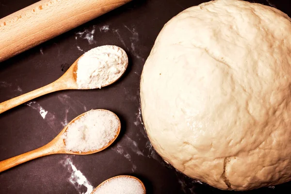 Yeast Dough Rolling Pin Three Wooden Spoons Sugar Salt Flour — Stock Photo, Image