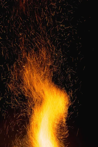 sparks from a big fire at night