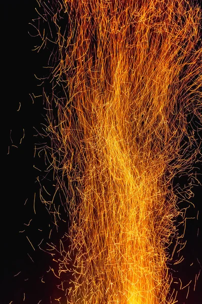 sparks from a big fire at night