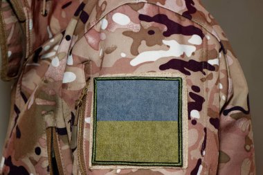 Ukraine Soldier. Soldier with flag Ukraine, Ukraine flag on a military uniform. Camouflage clothing