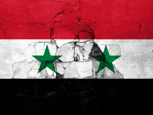 Earthquakes in Syria, flag Syria on a wall with cracks from an earthquake