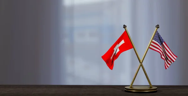 瑞士和美国的国旗在桌上 瑞士和美国之间的谈判 背景有点模糊 3D作品和3D图像 — 图库照片