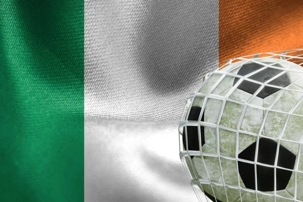 UEFA EURO 2024 Soccer, Ireland National flag with a soccer ball in net, 3D work and 3D image. Yerevan, Armenia - 2023 April 03